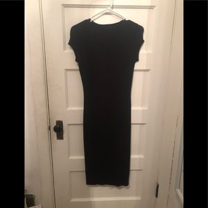 A black mid length dress